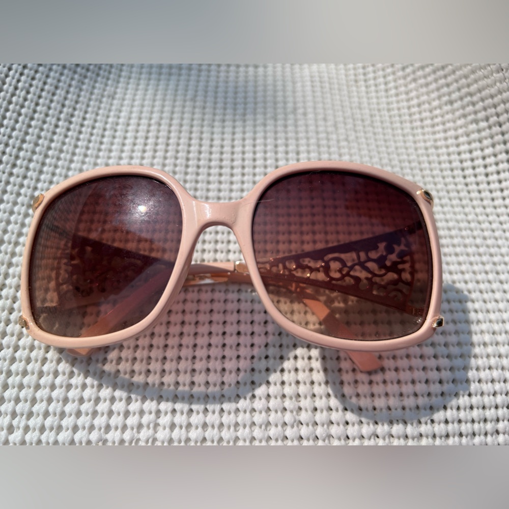 Vintage Chic Pink Sunglasses with Gold Accent Arms.
